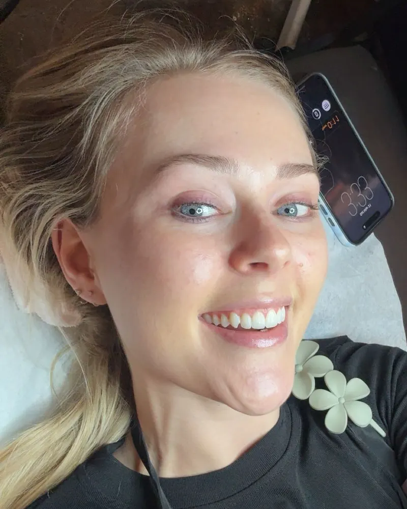 Haley smiling on a treatment bed